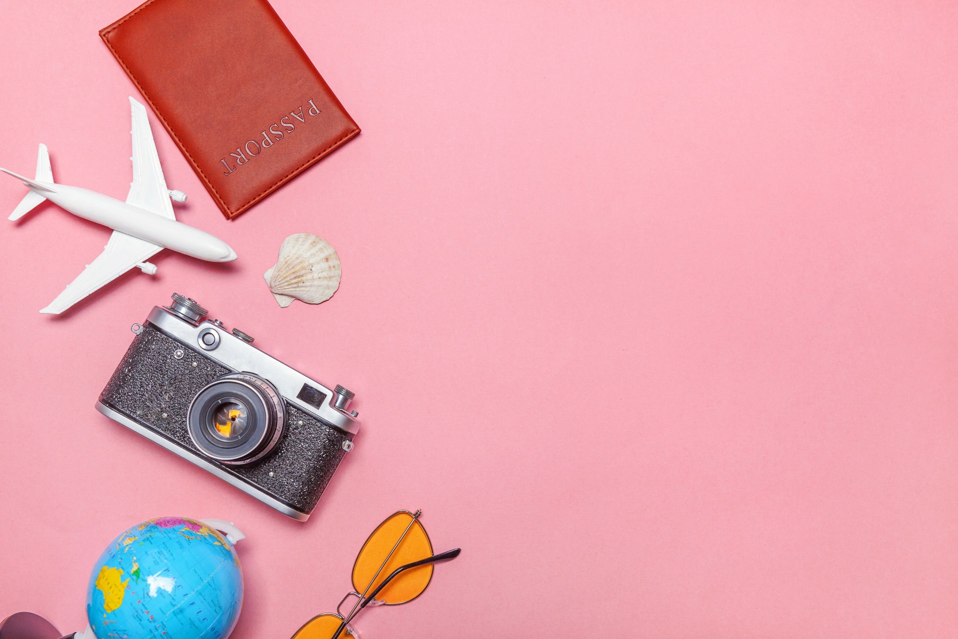 Minimal simple flat lay travel adventure trip concept on pink pastel trendy modern background