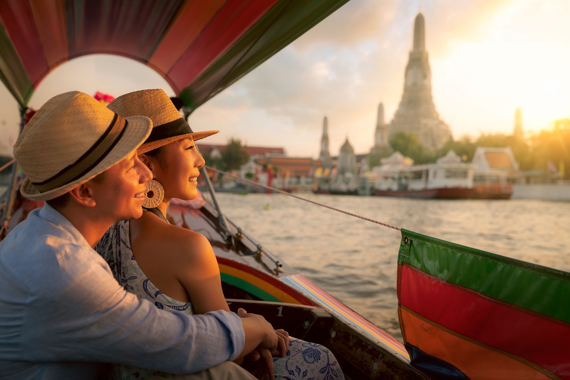 Wat Arun Ratchawararam temple. Couple traveller with boat in the Arun temple, landmark thailand